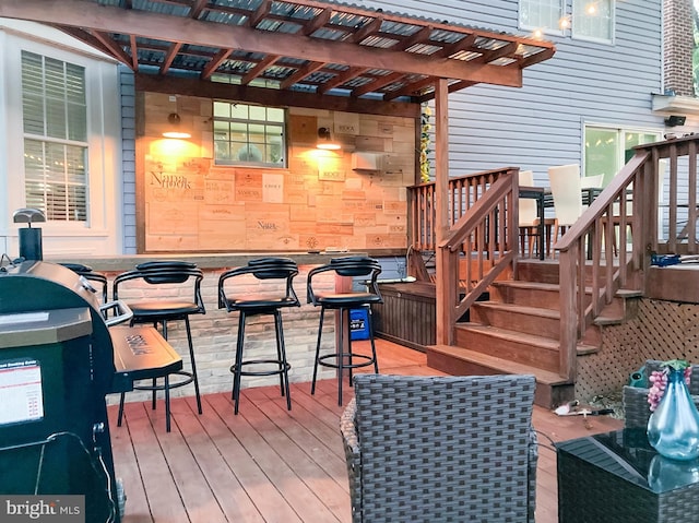 wooden deck with a pergola