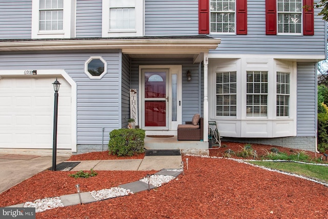 doorway to property featuring a garage