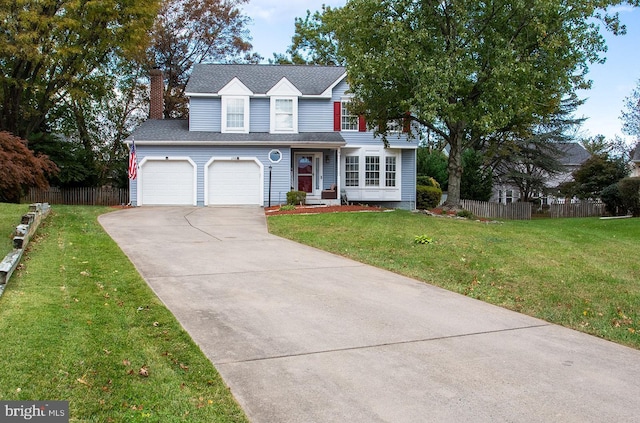 view of front of house featuring a front yard and a garage