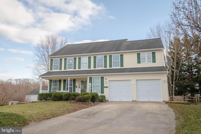 view of front of house featuring a garage and a front yard