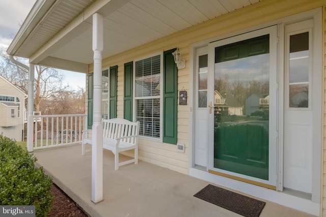 doorway to property with a porch