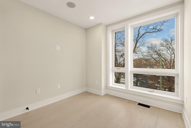 spare room with light wood-type flooring