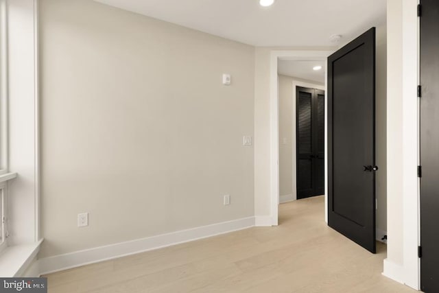 unfurnished room featuring light hardwood / wood-style floors