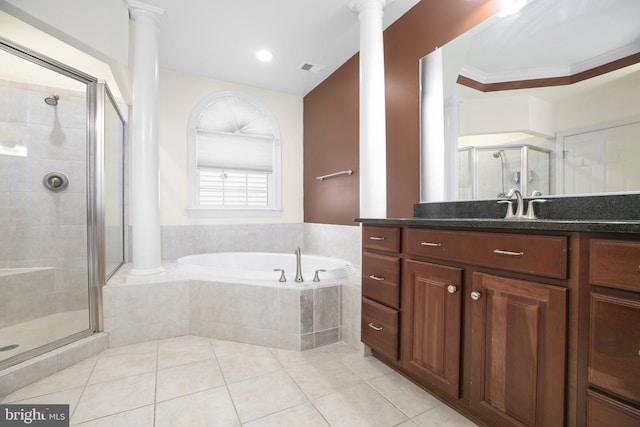 bathroom with ornate columns, independent shower and bath, and ornamental molding