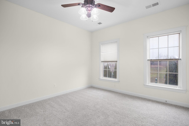 empty room featuring carpet and ceiling fan