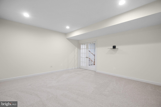 spare room with carpet and french doors