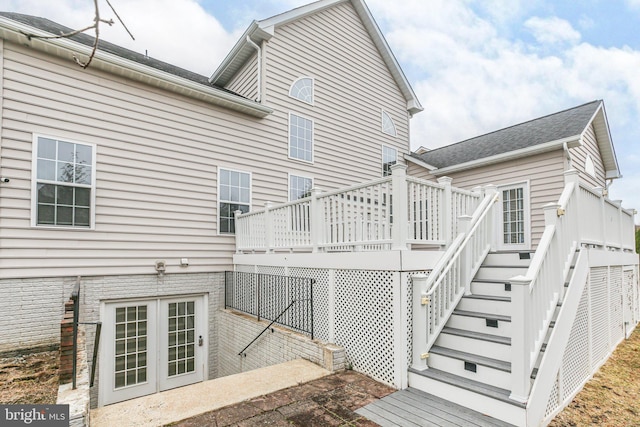 rear view of property with a wooden deck