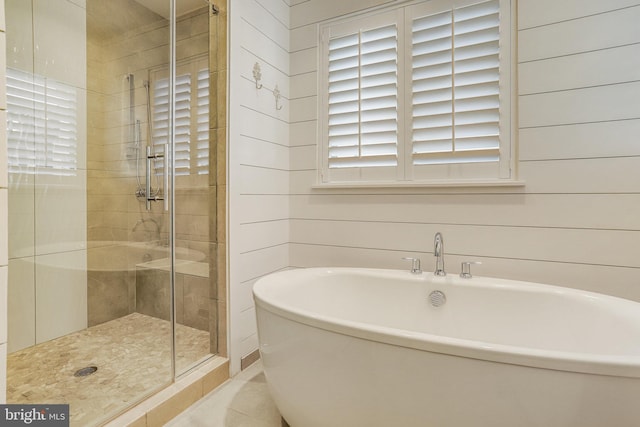 bathroom with wood walls and plus walk in shower