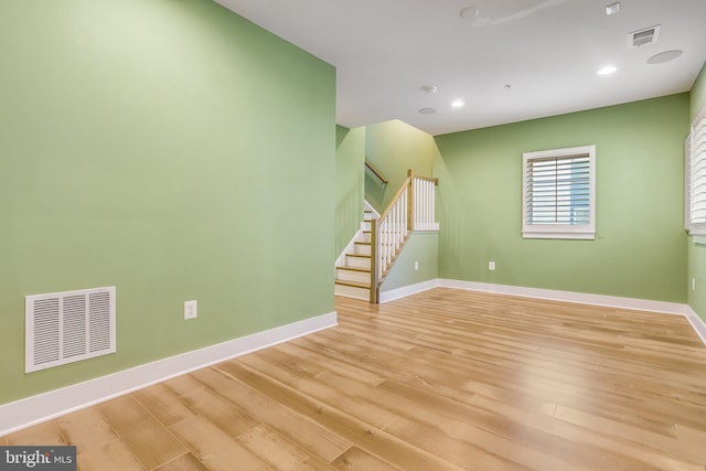 spare room with light wood-type flooring