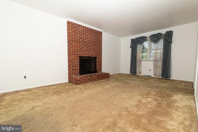 325 Great Oak Dr, Middletown, DE 19709 - unfurnished living room featuring a fireplace, carpet flooring, and baseboards