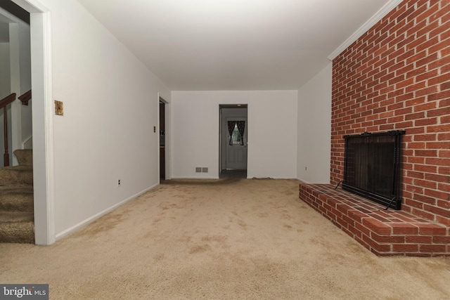 325 Great Oak Dr, Middletown, DE 19709 - unfurnished living room with carpet flooring, stairway, a fireplace, and baseboards