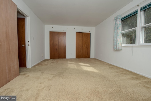 325 Great Oak Dr, Middletown, DE 19709 - unfurnished bedroom featuring two closets, carpet flooring, and baseboards