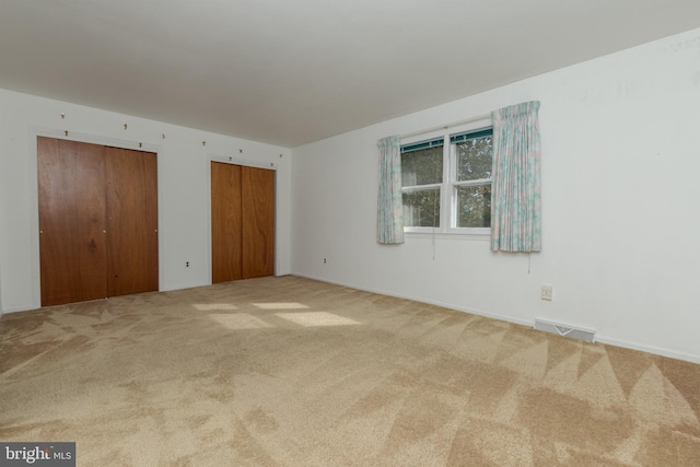 325 Great Oak Dr, Middletown, DE 19709 - unfurnished bedroom with carpet flooring, multiple closets, and baseboards