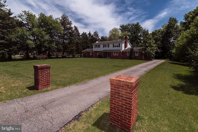 325 Great Oak Dr, Middletown, DE 19709 - view of front of home featuring a front lawn and a chimney