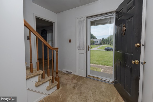 325 Great Oak Dr, Middletown, DE 19709 - entryway featuring stairway, carpet, and baseboards