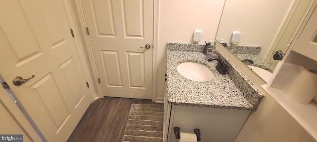 bathroom with vanity and wood-type flooring