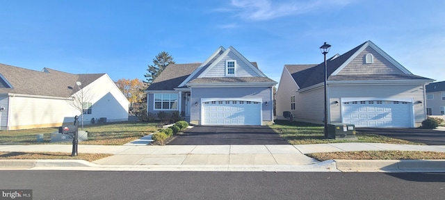 view of front facade with a garage and a front yard