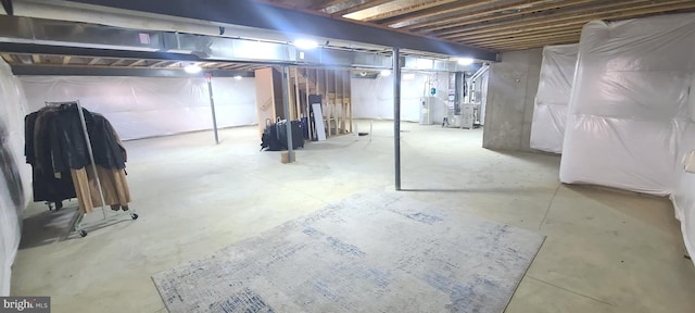 basement with heating unit and water heater