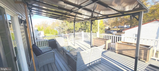 wooden deck with an outdoor hangout area