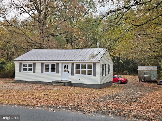 view of front facade with a storage unit