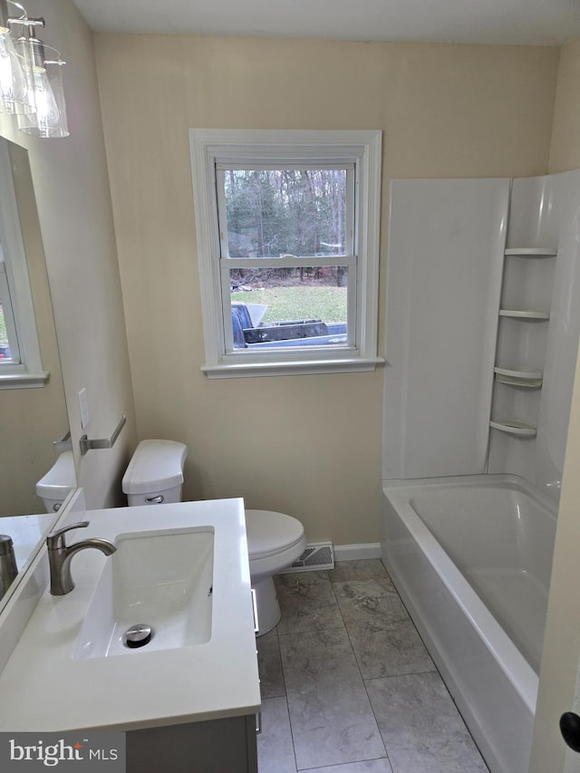 full bathroom with vanity,  shower combination, and toilet