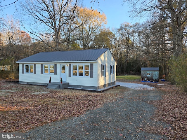 view of front of house with a shed