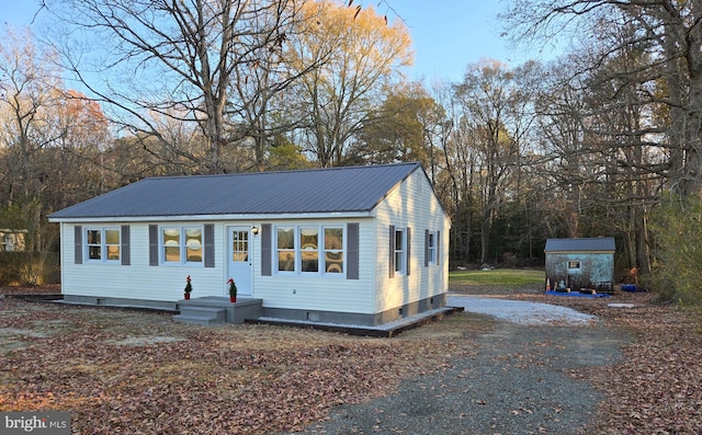 view of front of house with a shed