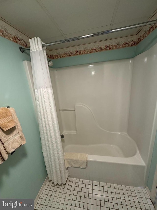 bathroom featuring tile patterned flooring and shower / bath combo with shower curtain