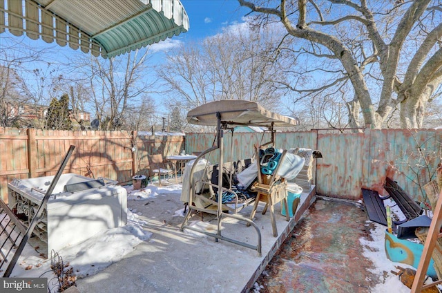 view of snow covered patio