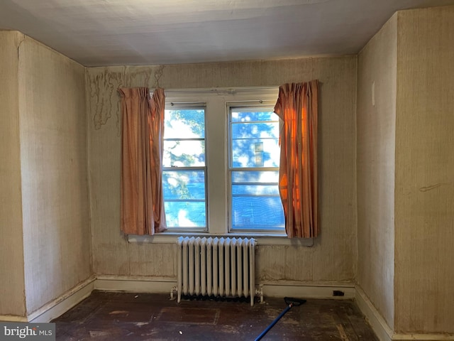 unfurnished room with radiator