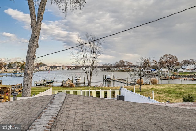 view of patio / terrace featuring a water view and a boat dock