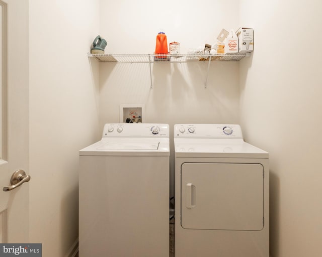 laundry room featuring washing machine and clothes dryer