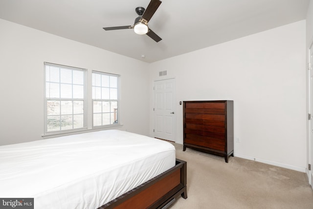 carpeted bedroom featuring ceiling fan