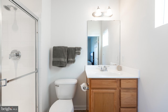 bathroom featuring plenty of natural light, an enclosed shower, and toilet