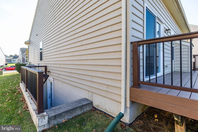 view of side of home with a deck