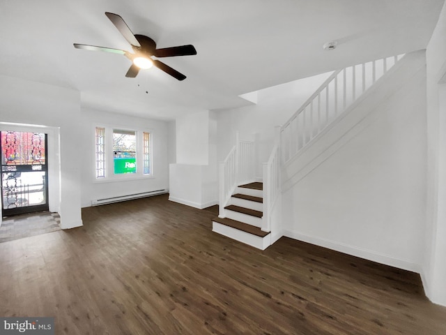 unfurnished living room with baseboard heating, dark wood-type flooring, and ceiling fan