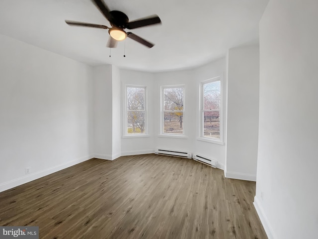 unfurnished room with ceiling fan, light hardwood / wood-style floors, and a baseboard radiator