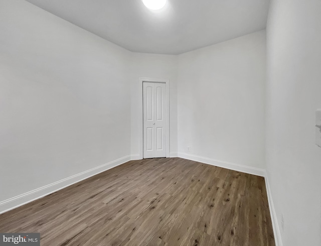 spare room featuring hardwood / wood-style floors