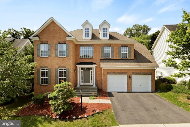 colonial inspired home featuring a garage