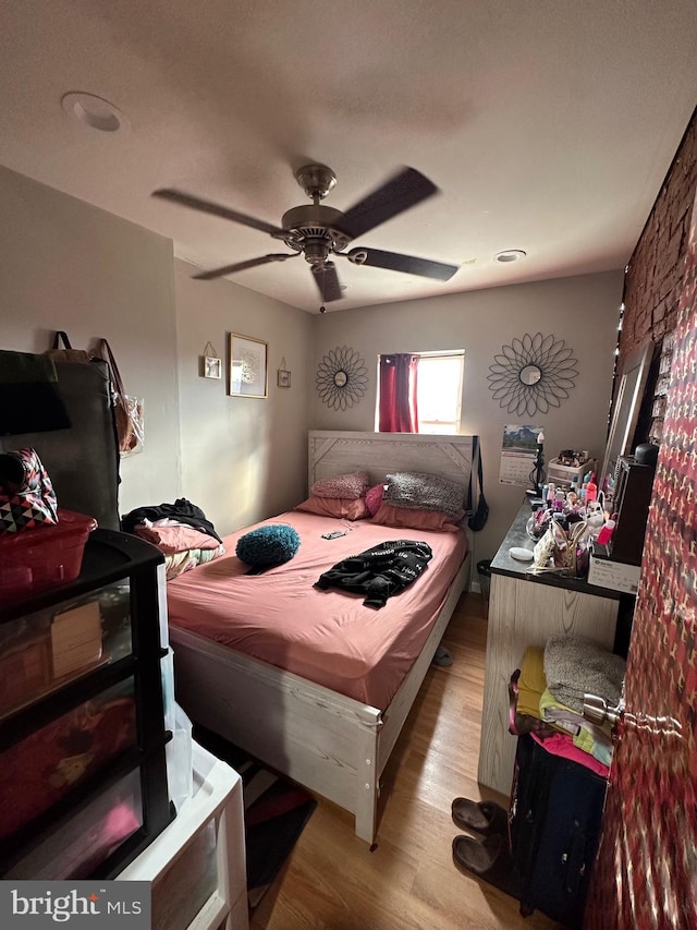 bedroom featuring ceiling fan and light wood-type flooring