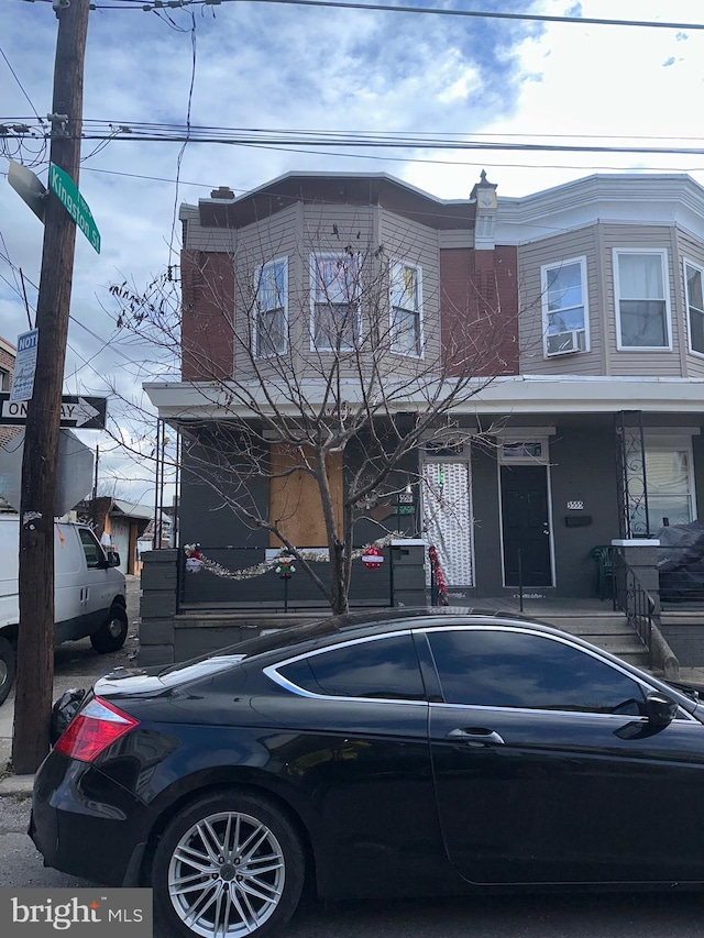 view of front of property featuring cooling unit