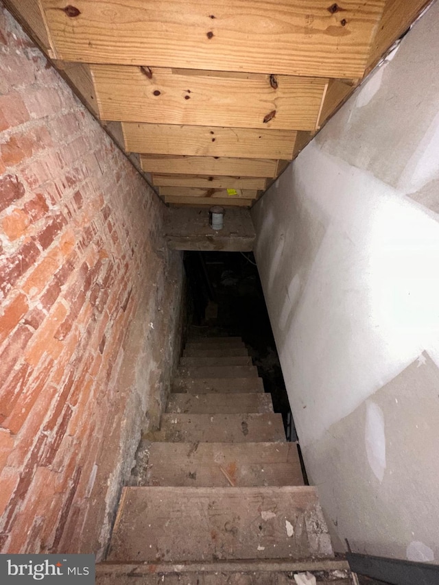 staircase with wooden ceiling