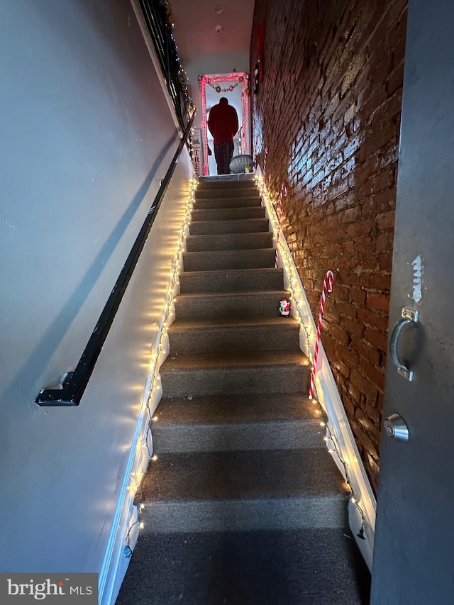 stairway with brick wall