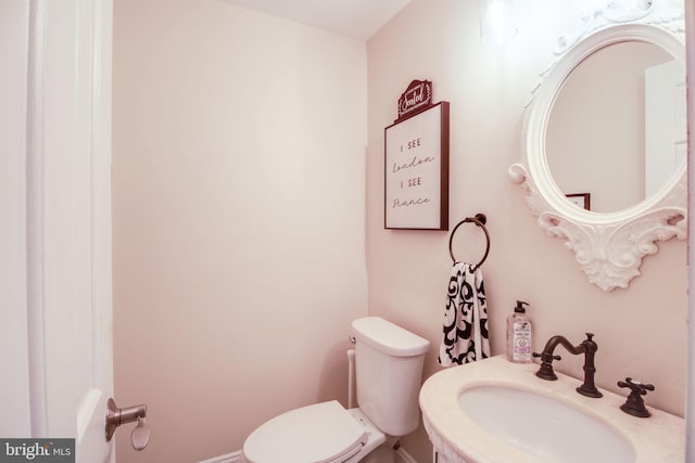 bathroom featuring sink and toilet