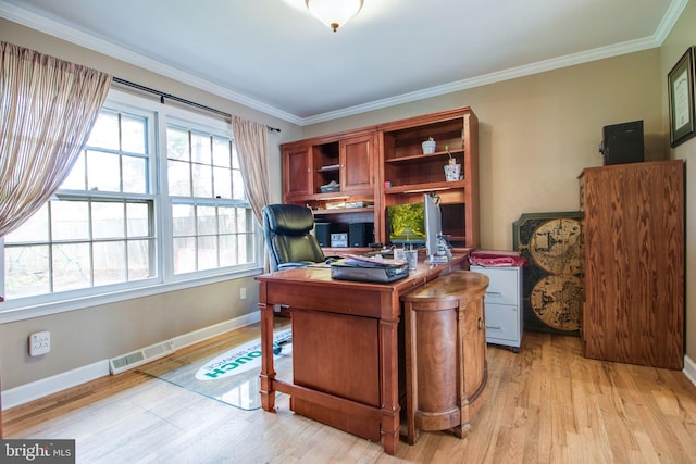 home office featuring crown molding and light hardwood / wood-style floors