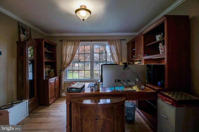 office space with light hardwood / wood-style floors and ornamental molding