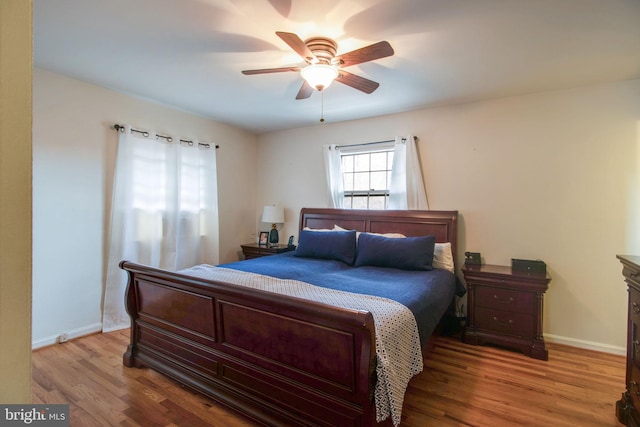 bedroom with ceiling fan and light hardwood / wood-style floors