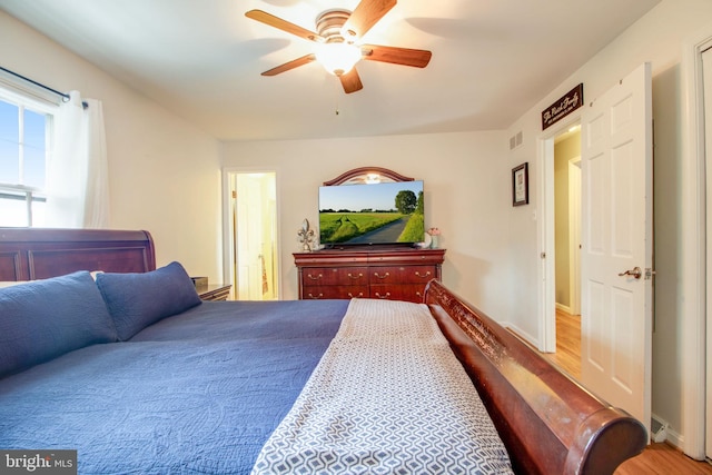 bedroom with hardwood / wood-style flooring and ceiling fan