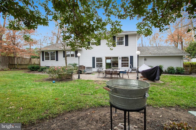 back of property featuring a patio area and a yard