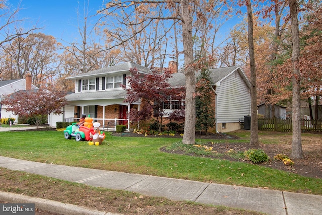 view of front of property with a porch and a front yard